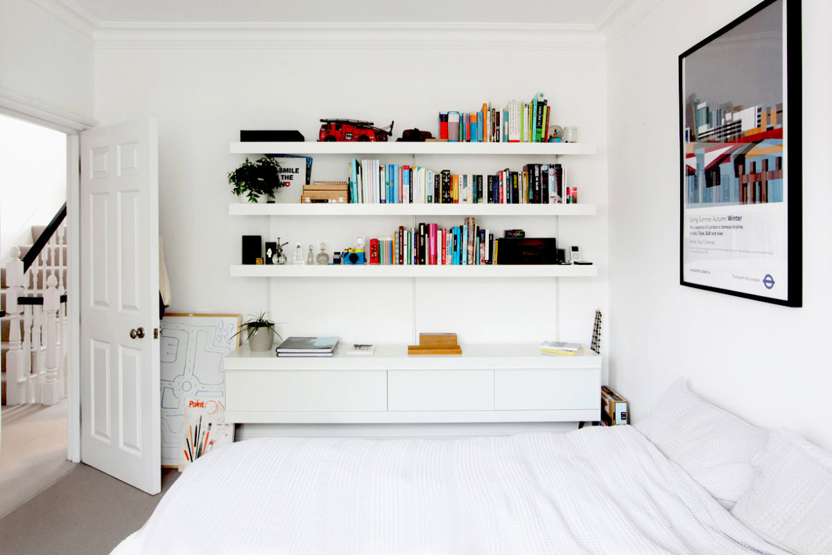 White shelving system with cabinets and shelves