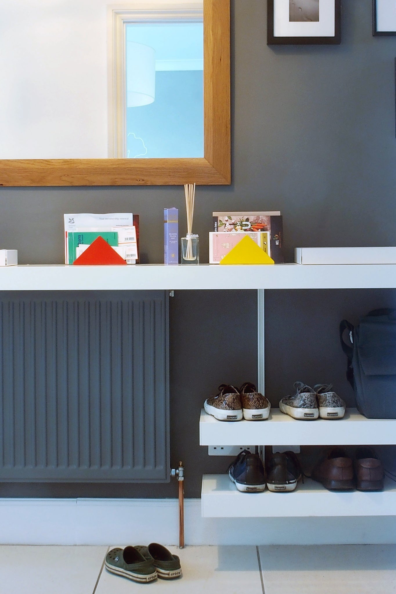 Hallway shelving designed over radiator for shoes and bags