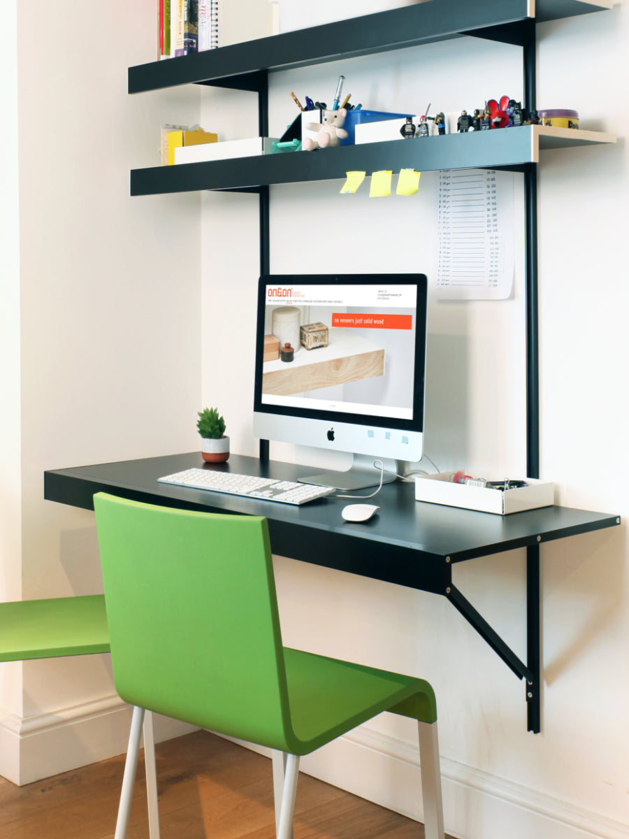 black shelving system with floating desk