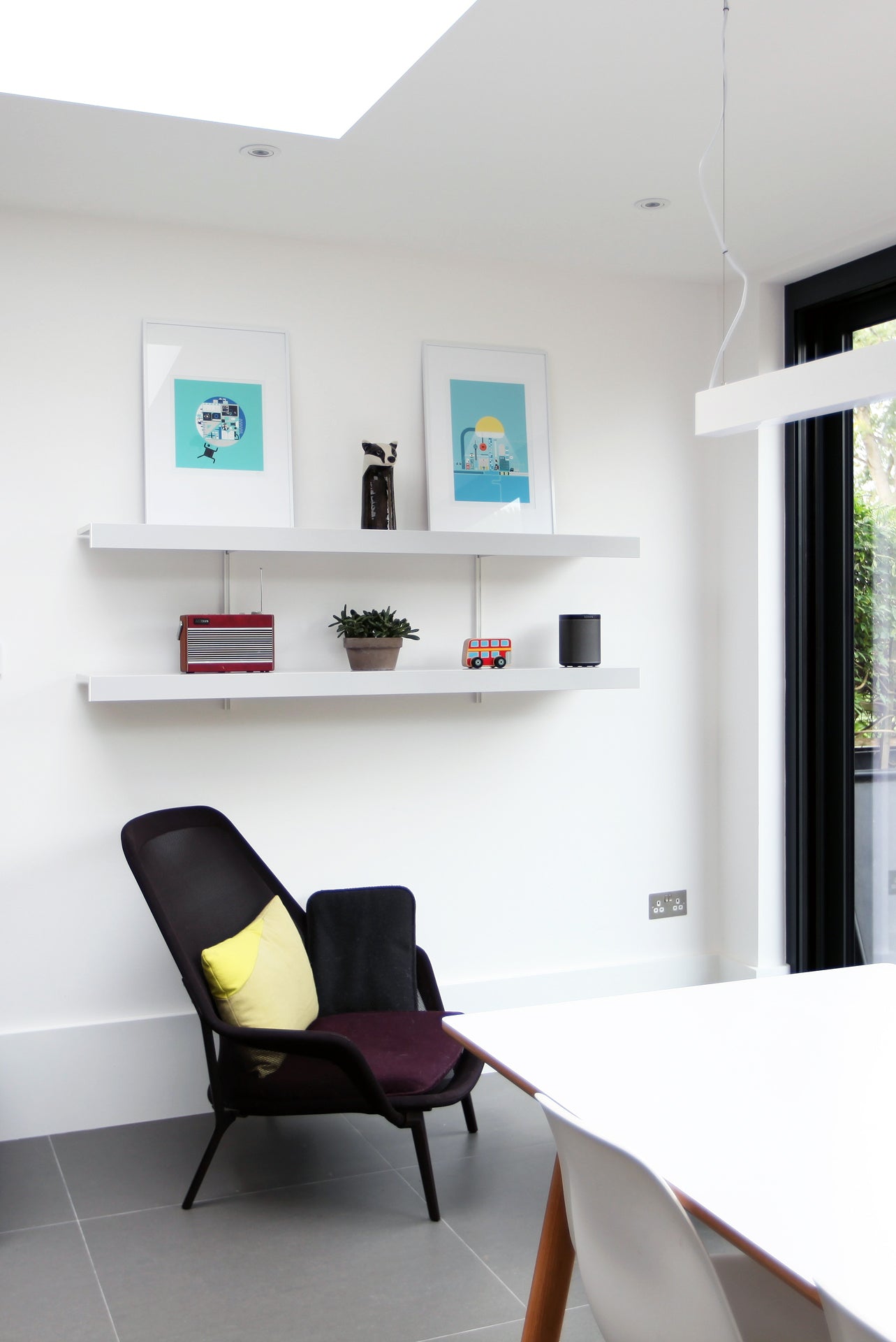 modern wall shelving with designer chair