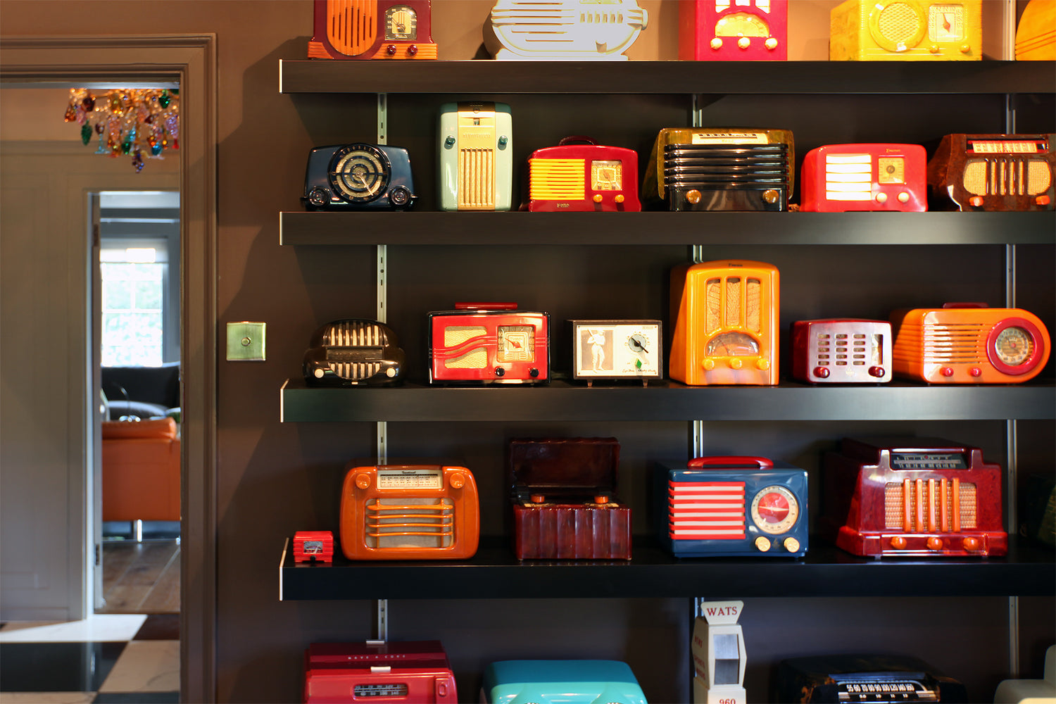 black shelving system with old radio collection