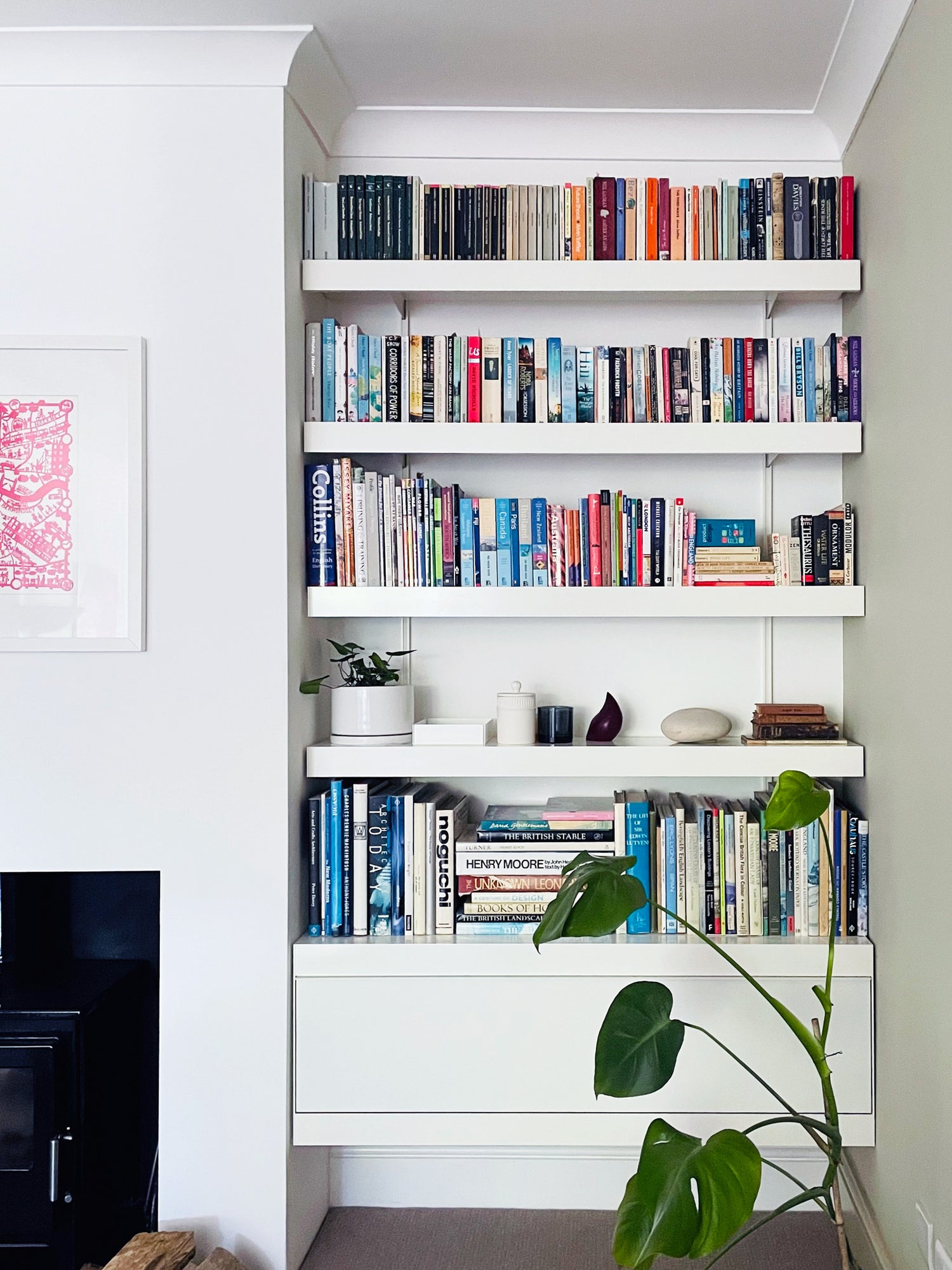 Fitted modern alcove shelving with wall cabinet and shelves above