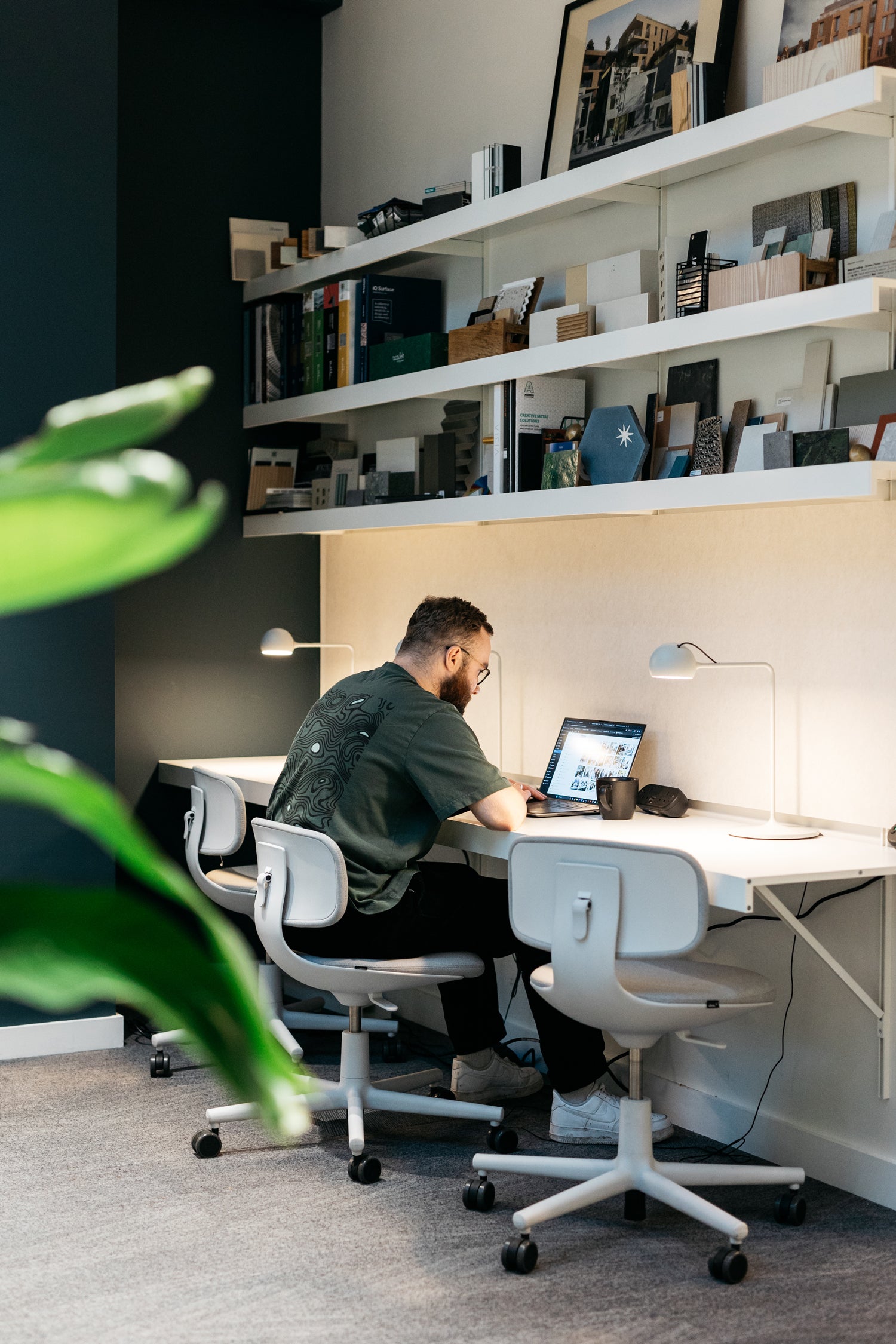 Architects office wall mounted desk and shelving above