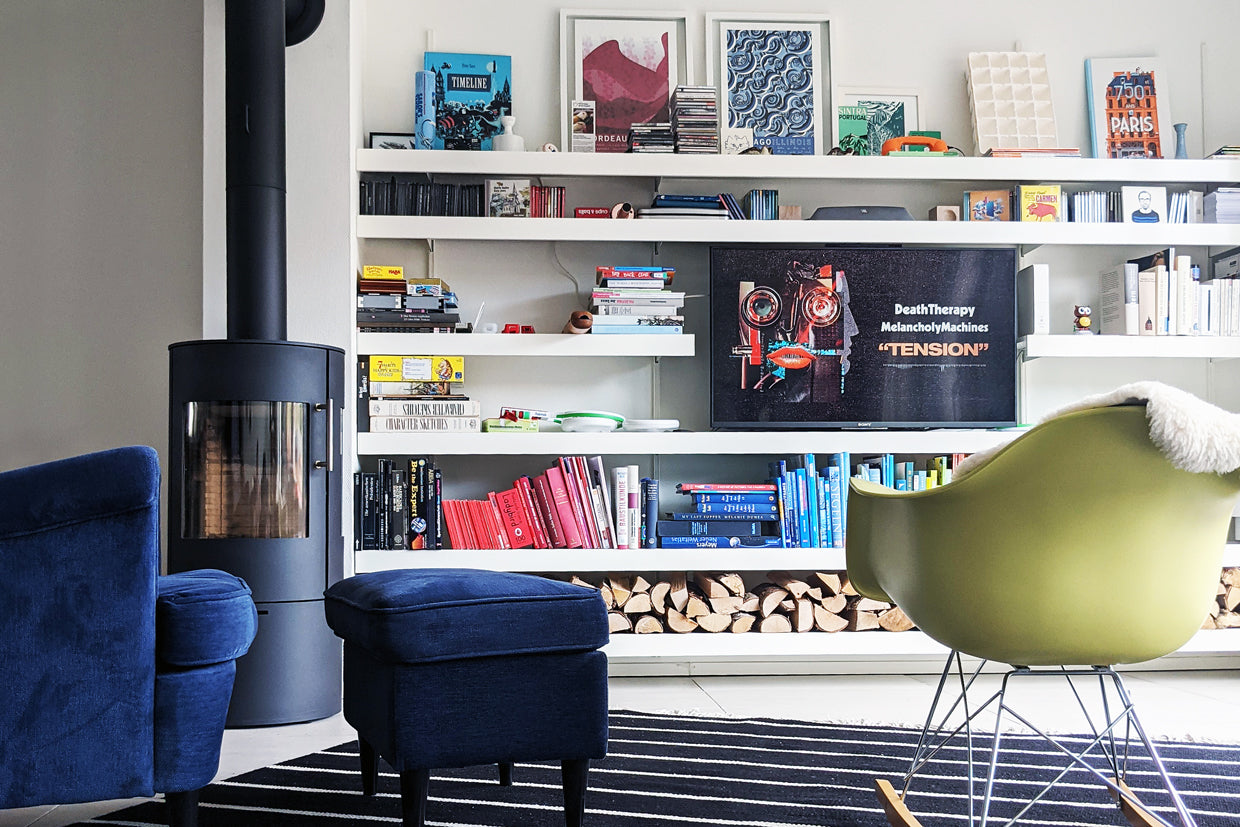 Wall shelves for TV and books with fire wood storage below
