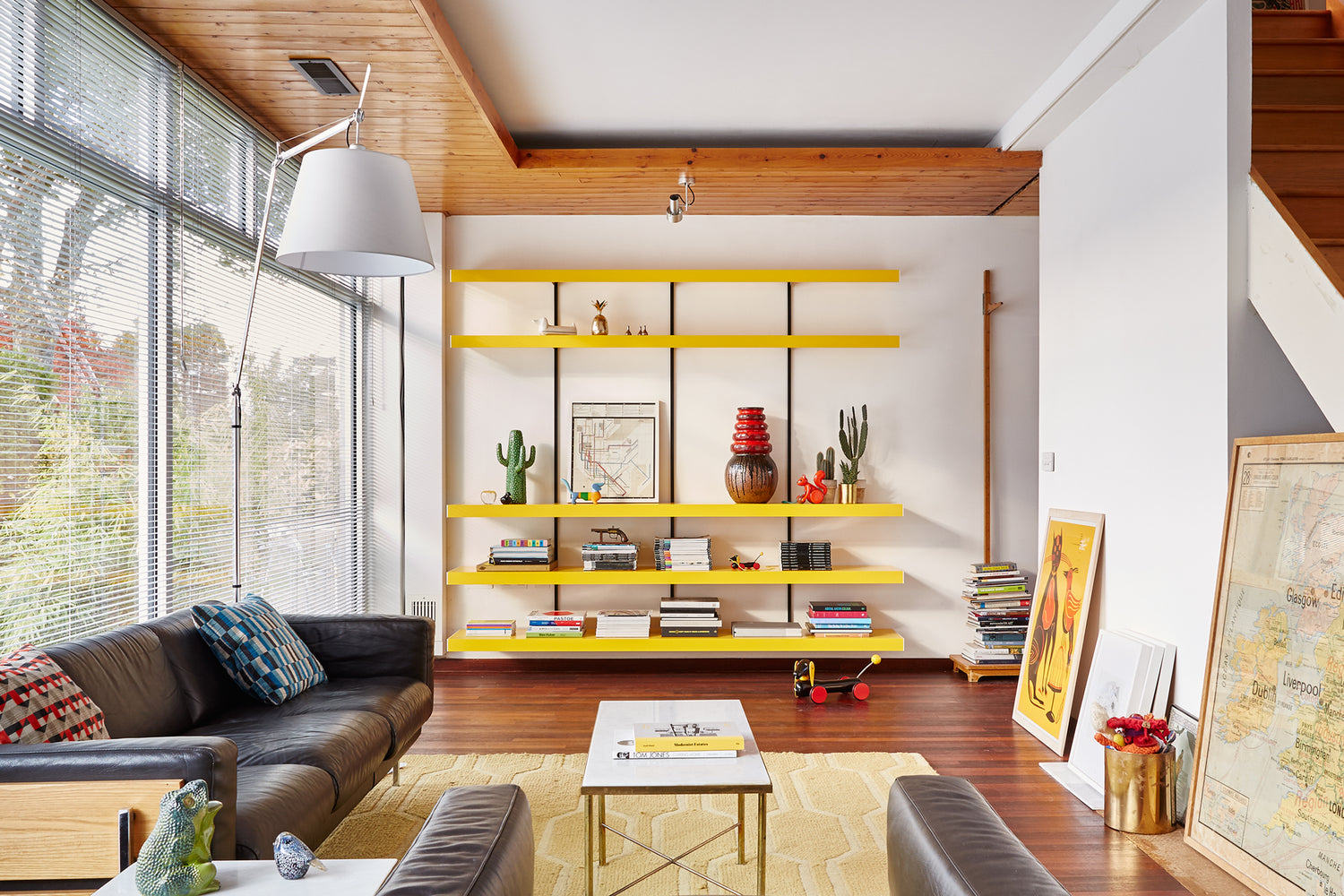 Yellow wall shelves in span house