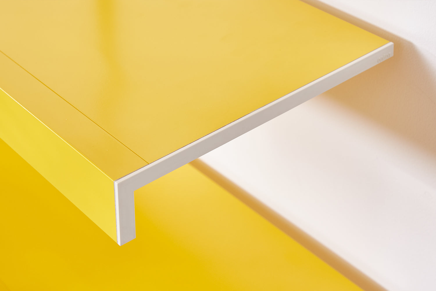 yellow aluminium wall shelf with white endcap