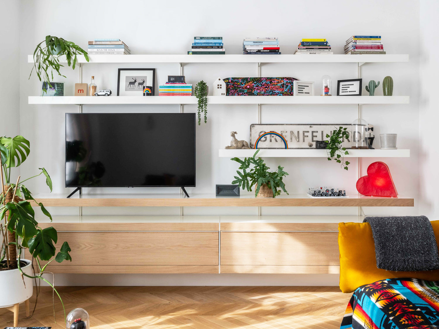 modern wall mounted TV unit with oak fronts and white shelves above