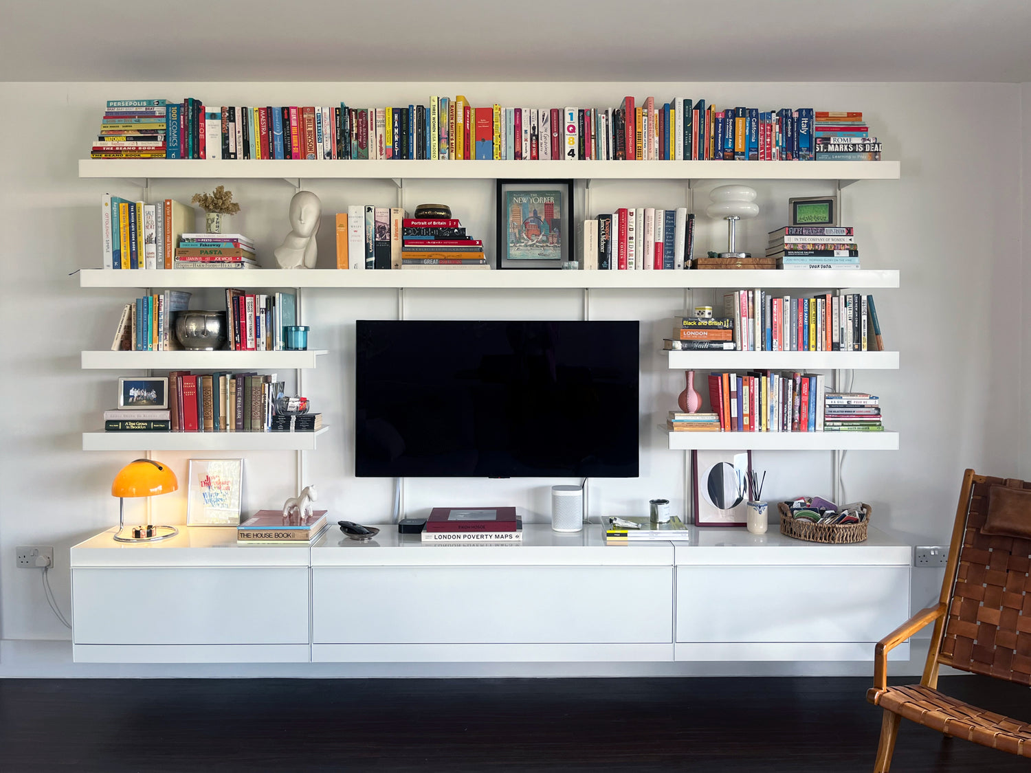 TV wall unit in white with cabinets and long shelves