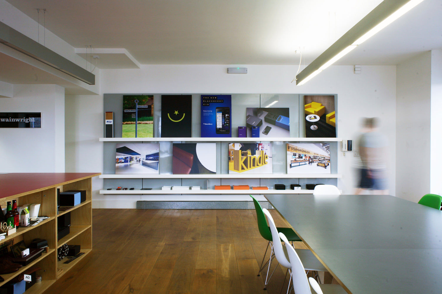 Design office with shelving wall display