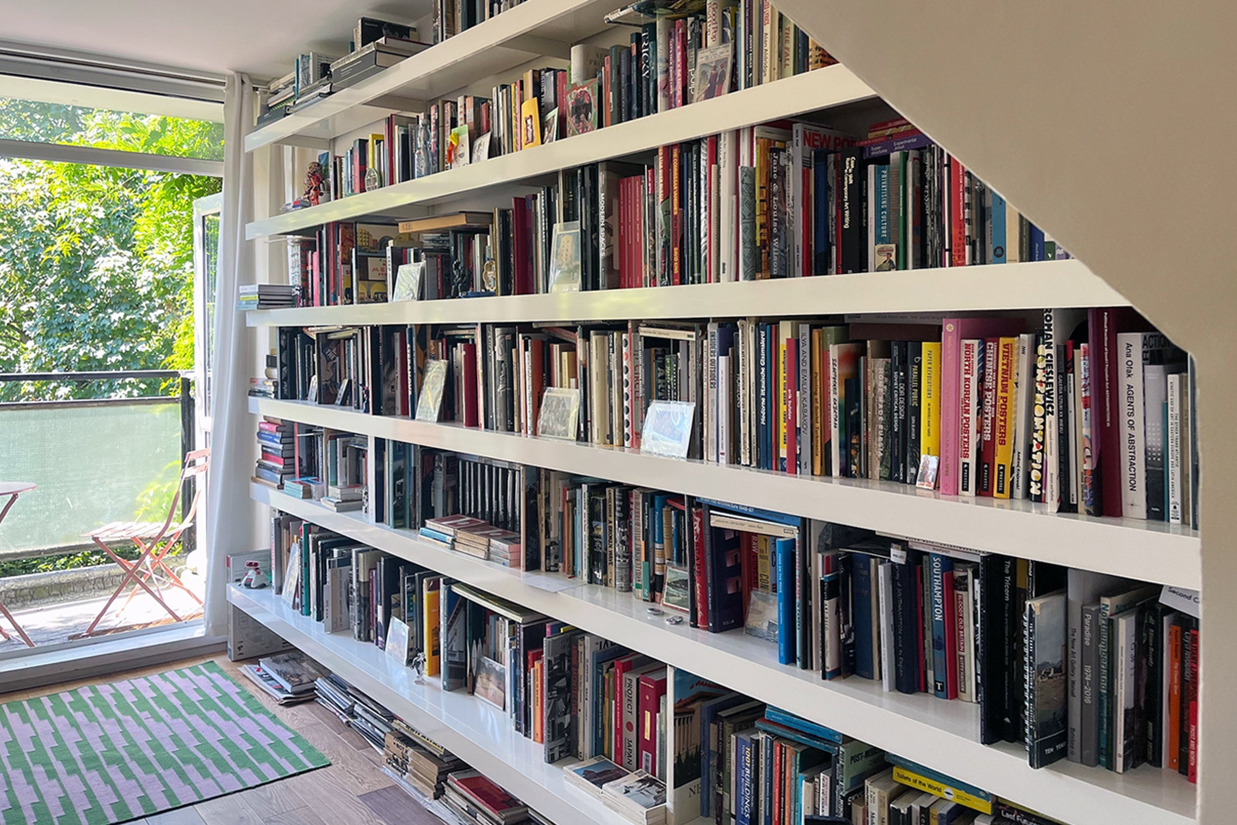 Large wall mounted book shelving system
