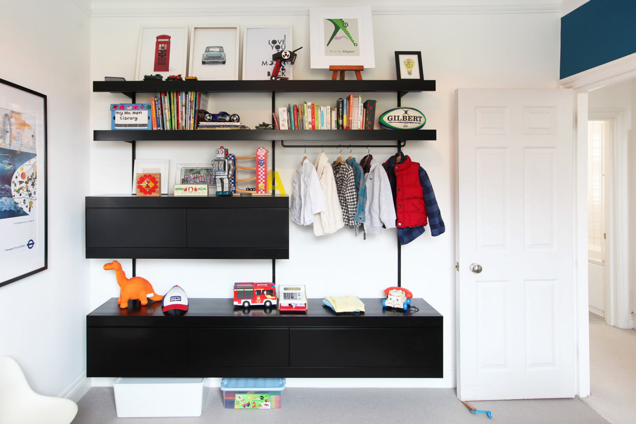 Bedroom wall mounted black shelving system in kids room