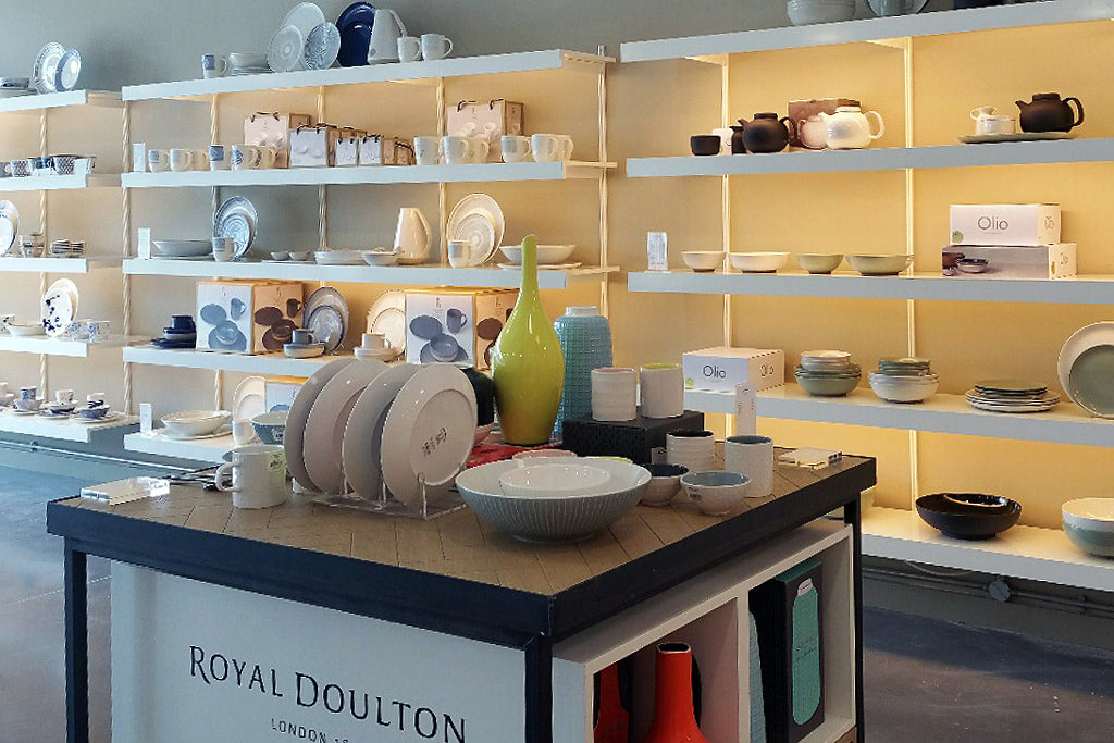 White shelving systems with lighting for Wedgewood display showroom