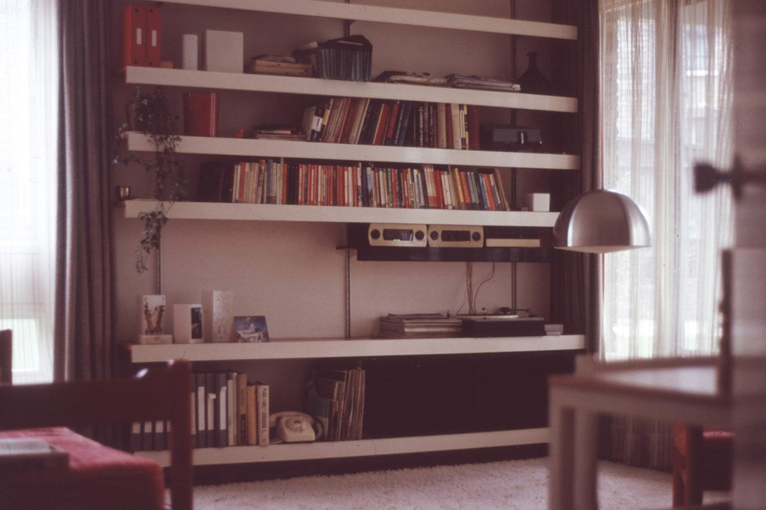 ON&ON shelving system in a 1960's living room with books, vinyl and record player