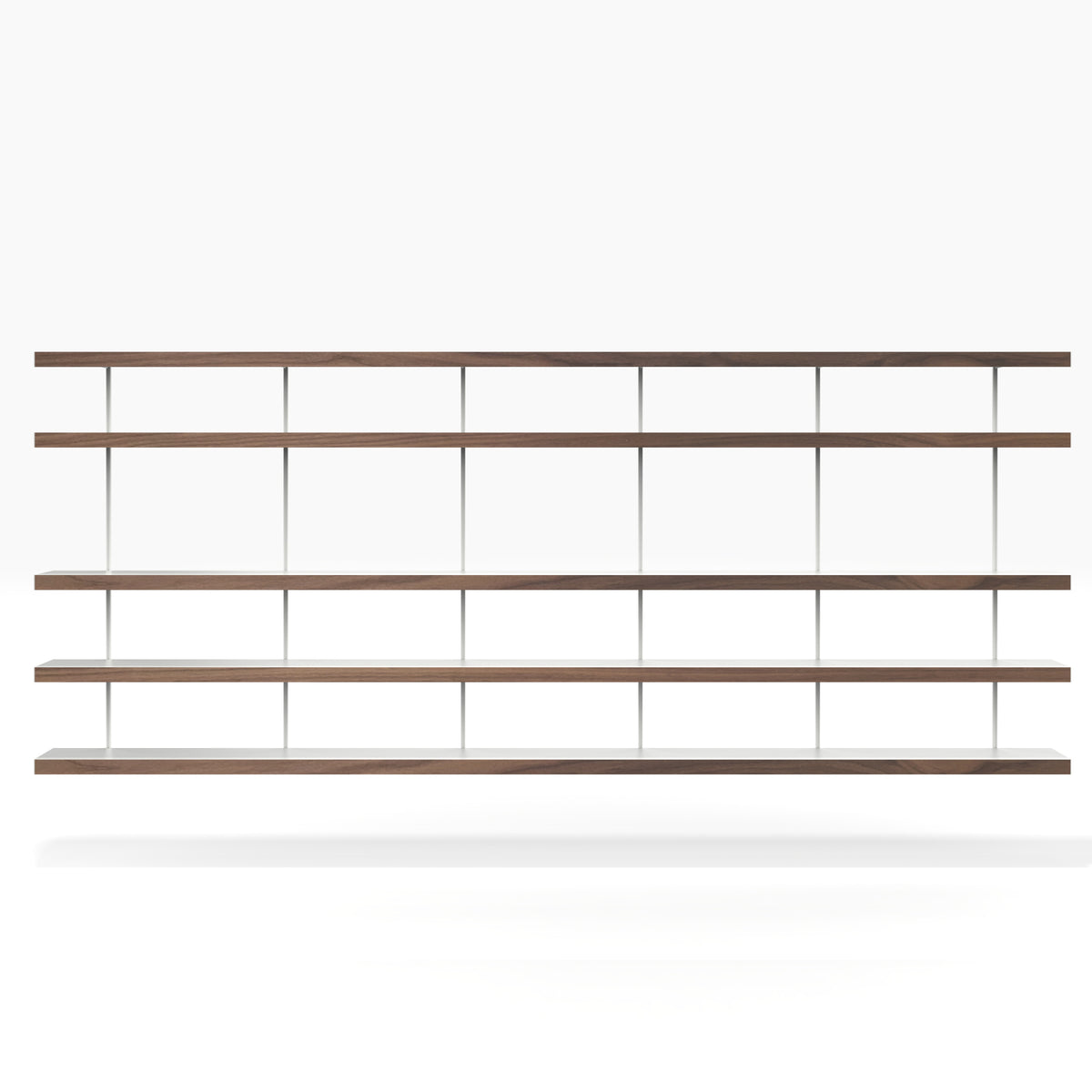 Large wall mounted book shelving system with long white and walnut shelves