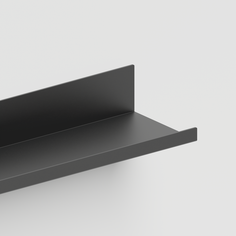 A close-up of a matte black metal shelf bracket corner against a light gray background.