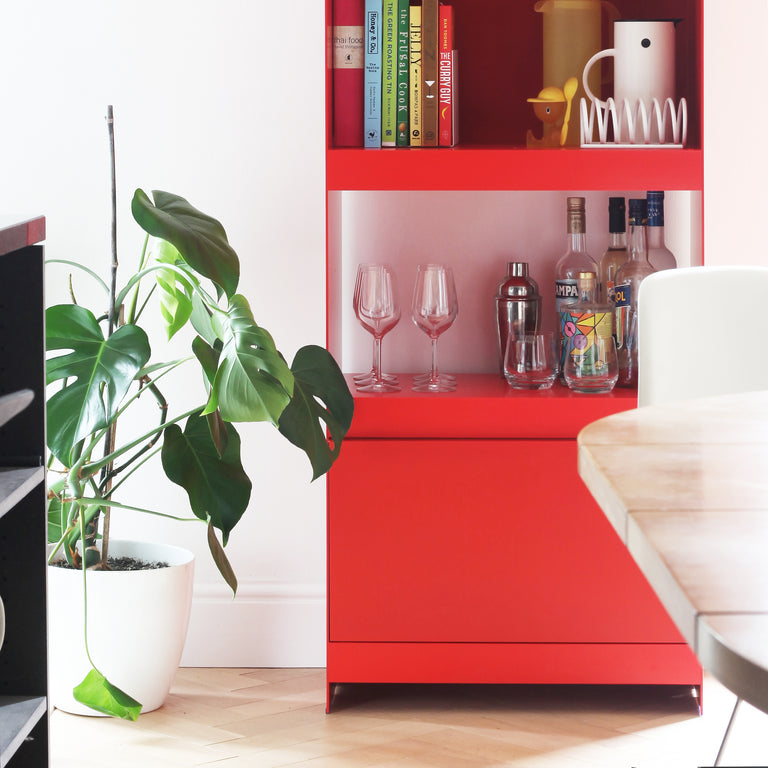 tall designer shelving unit in red 