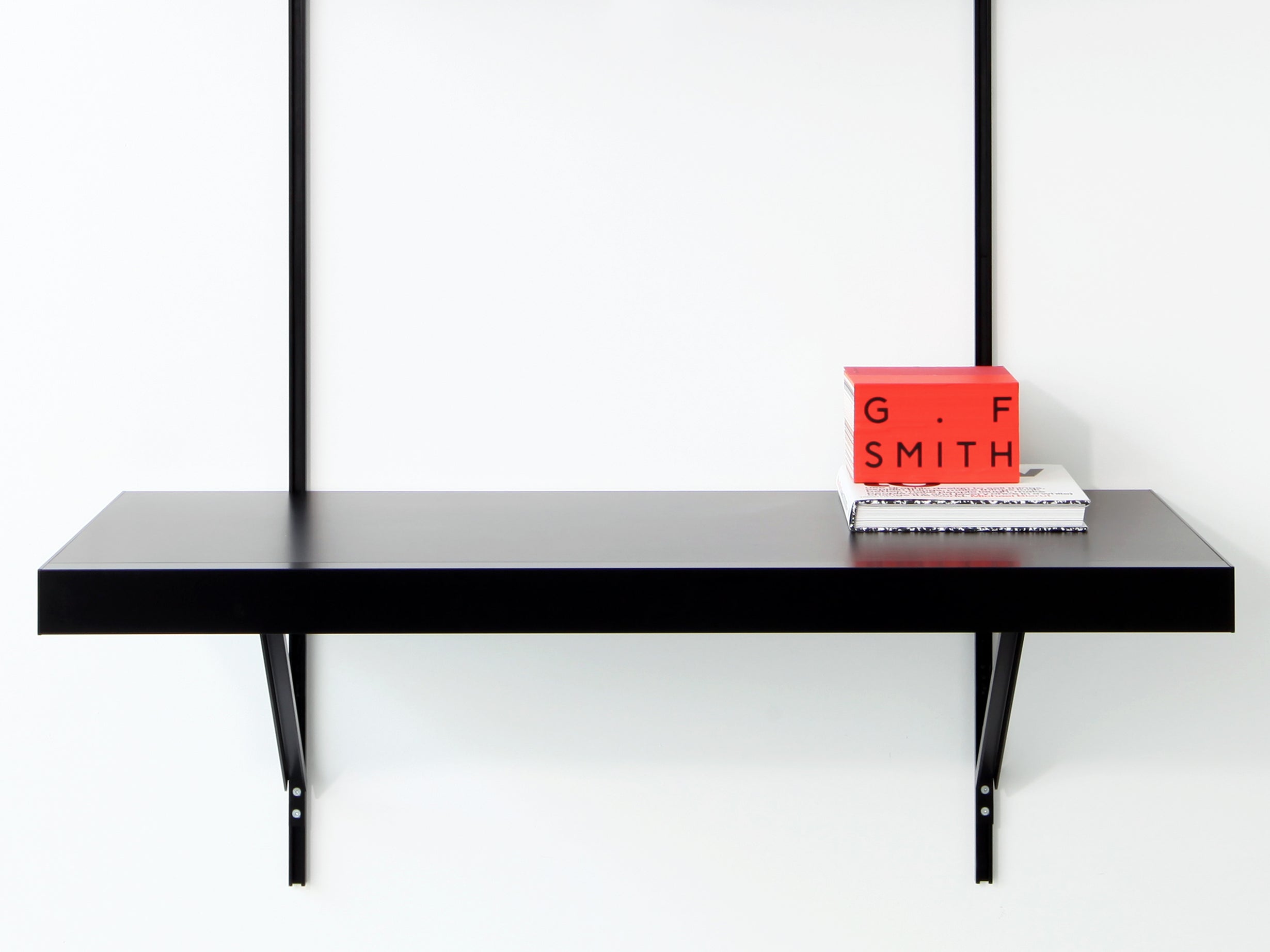 black modular shelving with desk